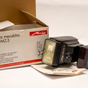 Operational Metz flash; SCA300D and SCA374/2 AF adapters; German manual and warranty card (blank); Original box.