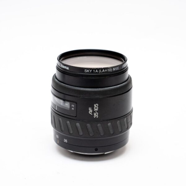 Minolta 35-105 3.5-4.5; Front and rear lids; Hama Sky 1A filter; P/S matching hood from Minolta 100-300.