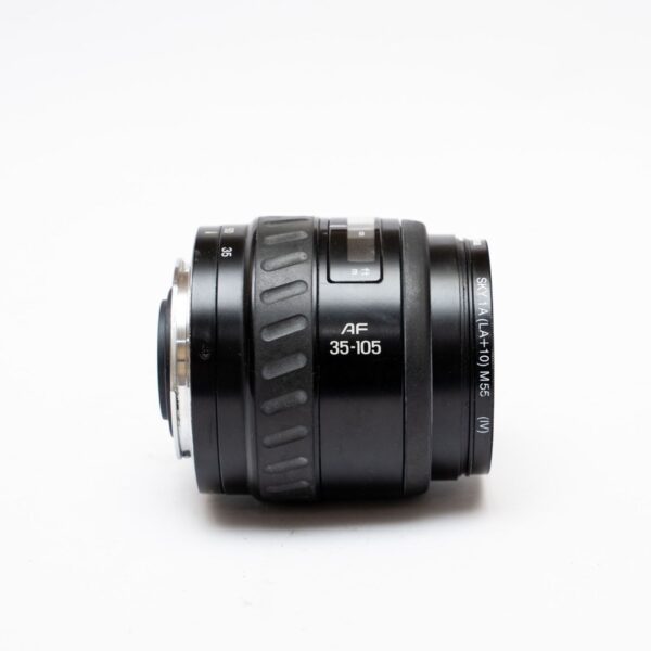 Minolta 35-105 3.5-4.5; Front and rear lids; Hama Sky 1A filter; P/S matching hood from Minolta 100-300.